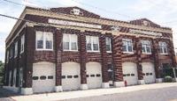 Stones bearing the dates 1930 and 1957 mark the growth of the Chincoteague Fire Department building on Main Street.